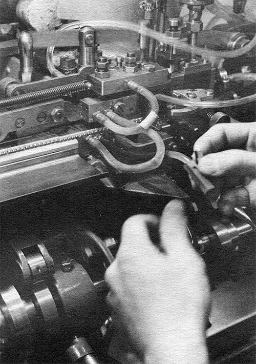 Halftone photograph of type advancing onto the delivery stick