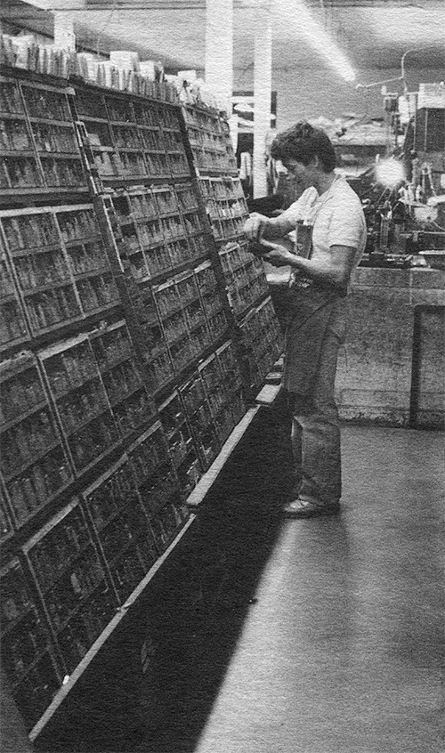 Halftone photograph of Steven standing at a two-sided case