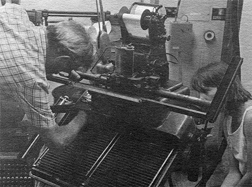 Photograph of Harry Wearn and Julia Ferrarie problem solving Rich's keyboard